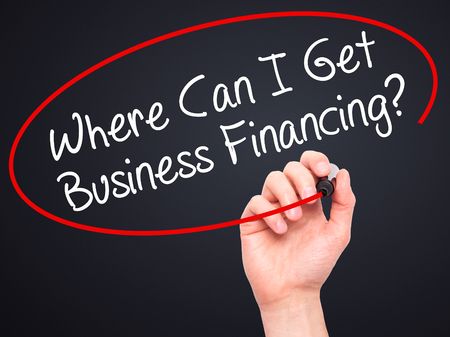 Hand circling the question 'whare can i get business financing' in red ink